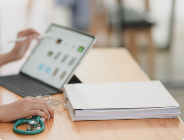 doctor and an ipad with medical equipment